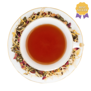 Best Seller, Inner Glow Herbal Tea in a white and gold vintage teacup and saucer