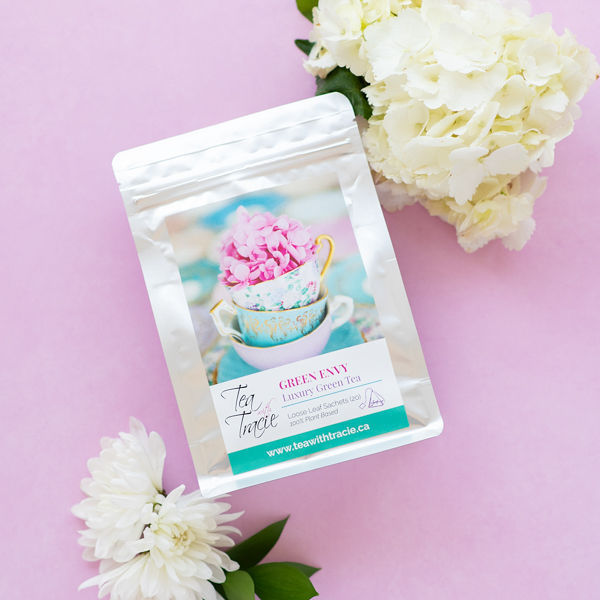 Green Envy green tea pouch with white flowers